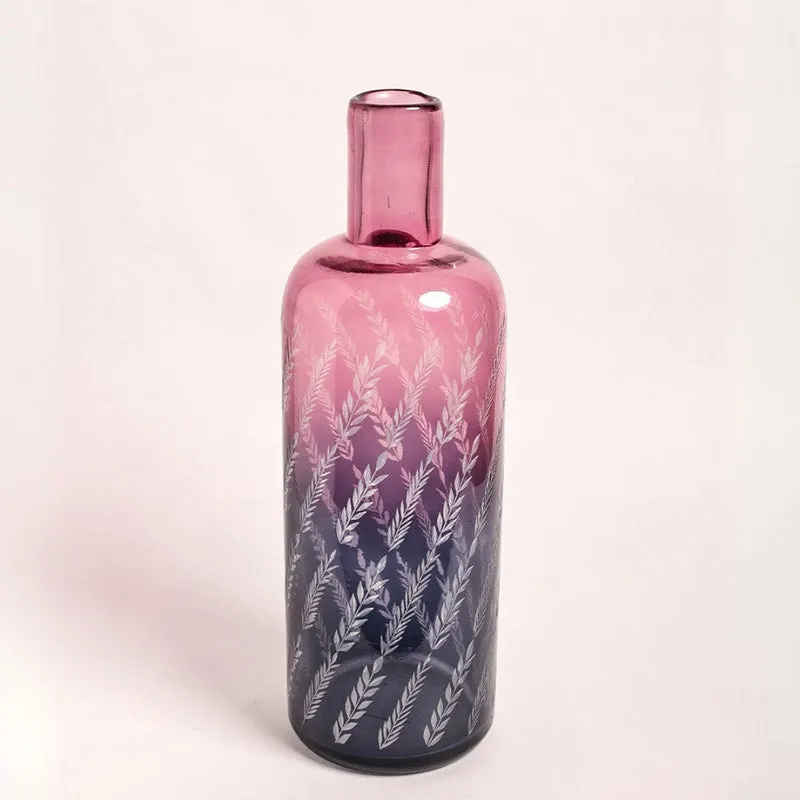 Angled view of etched pink and blue ombre glass bottle vase