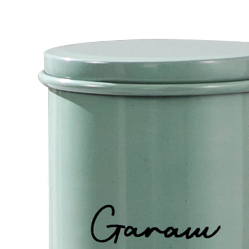 Close-up detail of the pastel green jar lid and script label