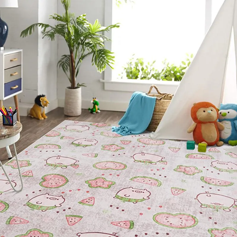 Kids carpet with pig and watermelon motifs in soft pink, green and grey tones
