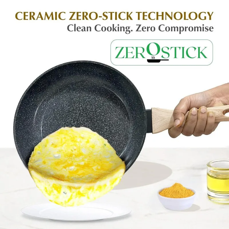 Frying pan held by its handle while an omelette slides onto a plate