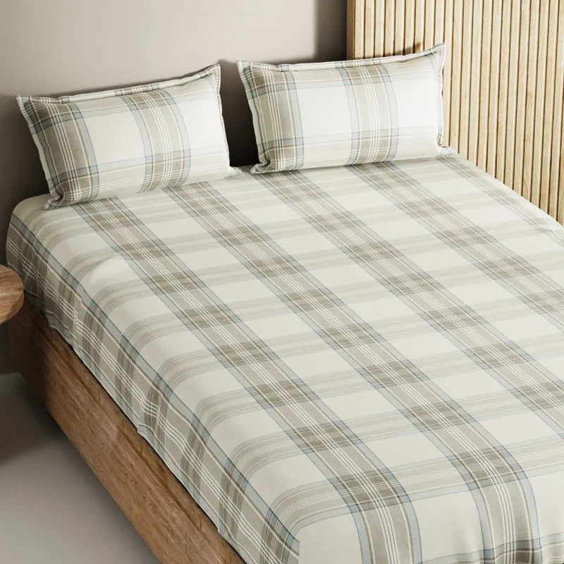 Close angled view of the geometric checked bedsheet and matching pillow covers
