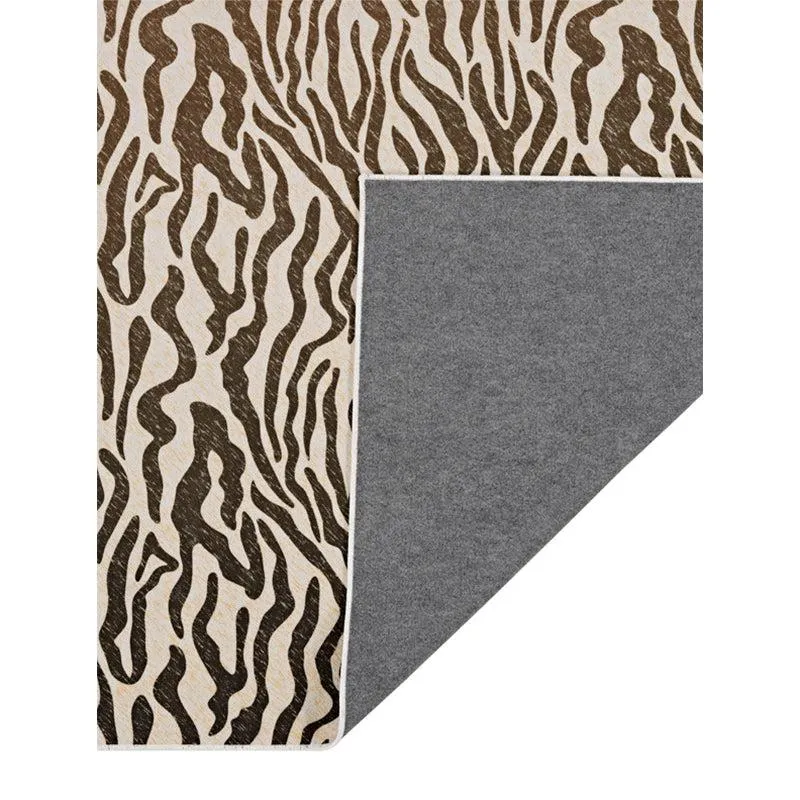 Back view of the carpet showing grey underside and patterned surface
