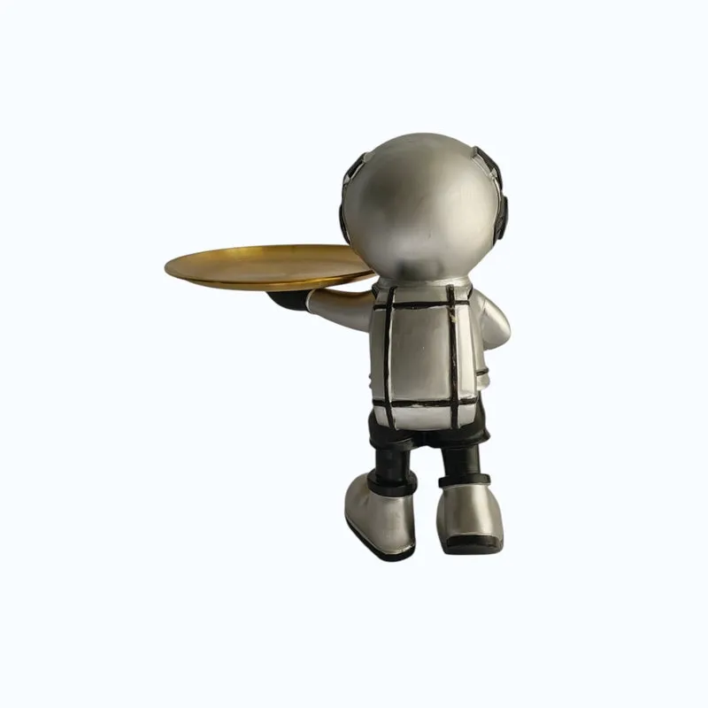 Back view of the astronaut figurine showing its backpack and tray