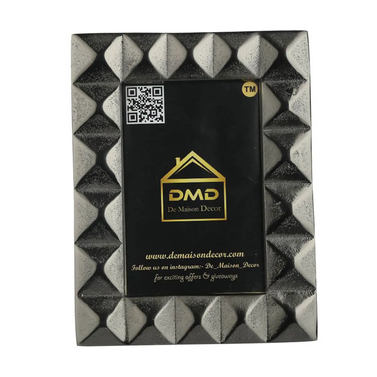 Back view of black geometric photo frame showing its stand and rear panel