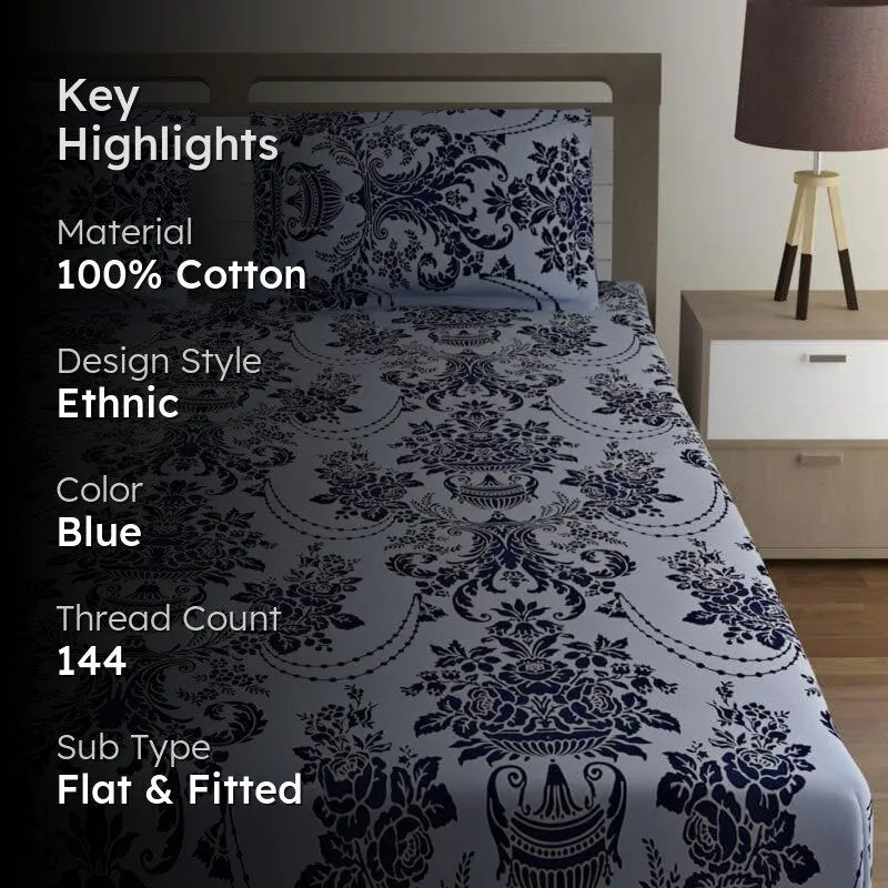 Light blue printed bedsheet with dark blue ethnic motif on a styled bed