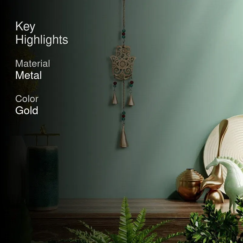 Gold Hamsa windchime shown in a styled room setting
