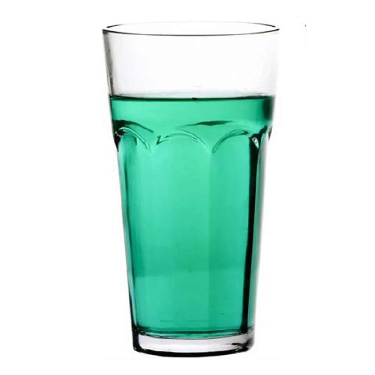 Transparent highball glass shown filled with a green beverage