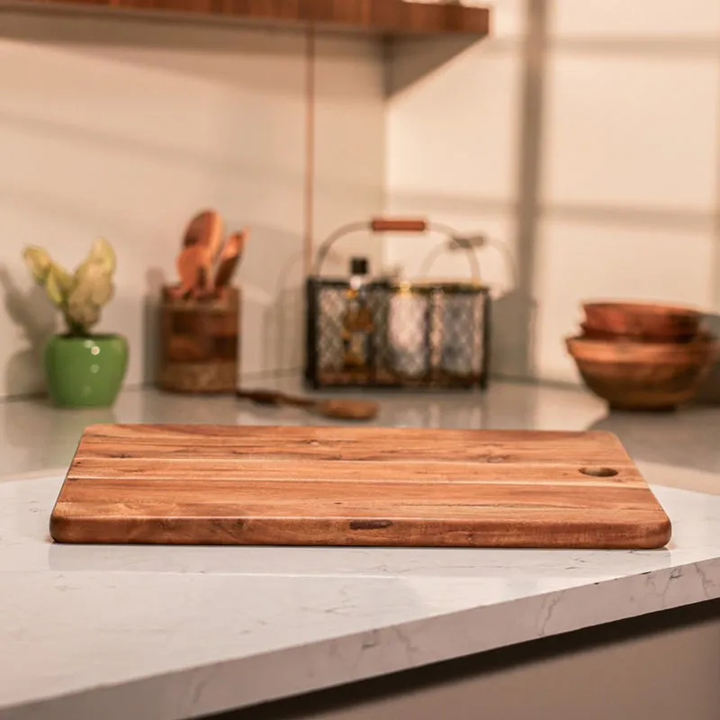 Natural wood chopping board displayed on a kitchen counter