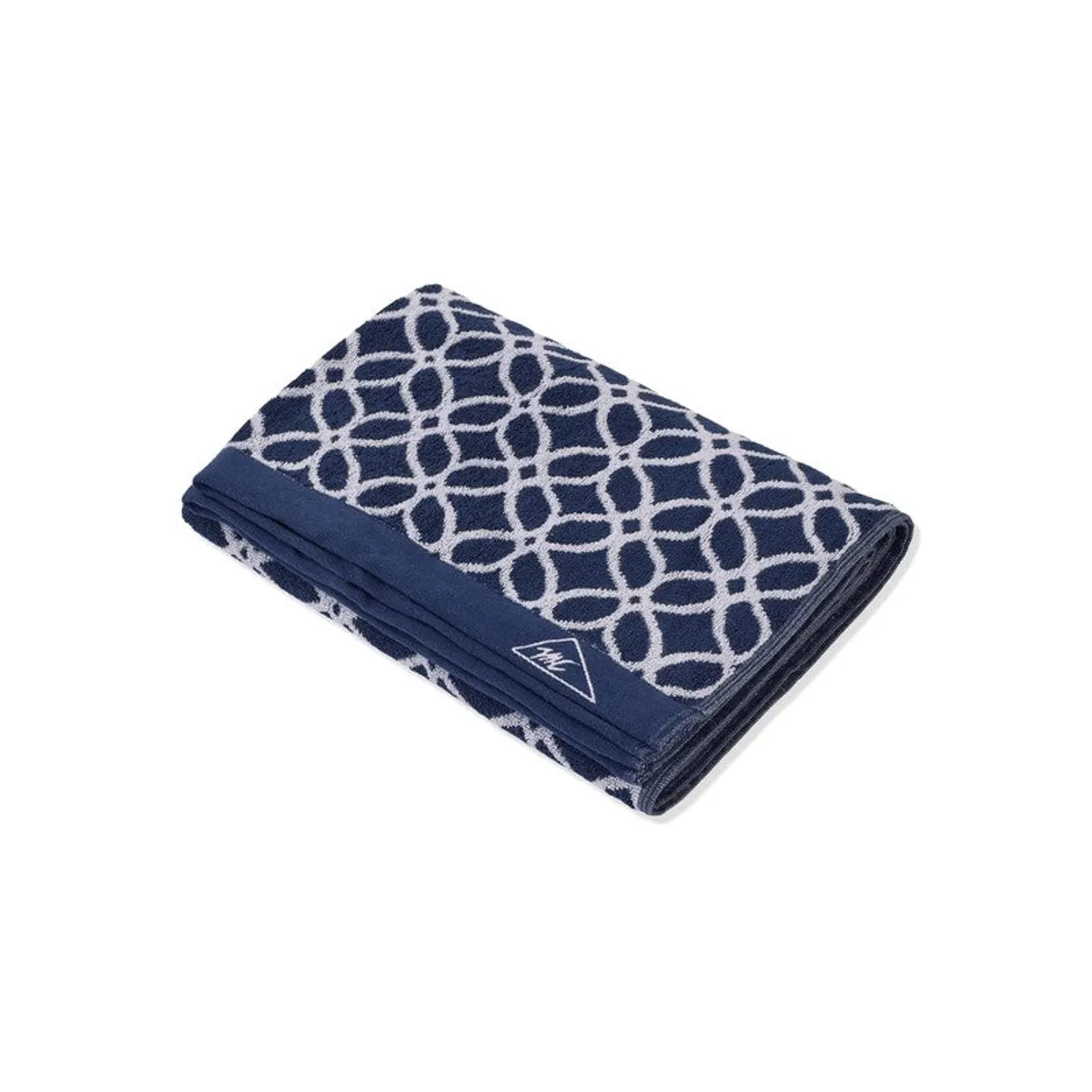 Folded blue and white patterned bath towel shown on a white background