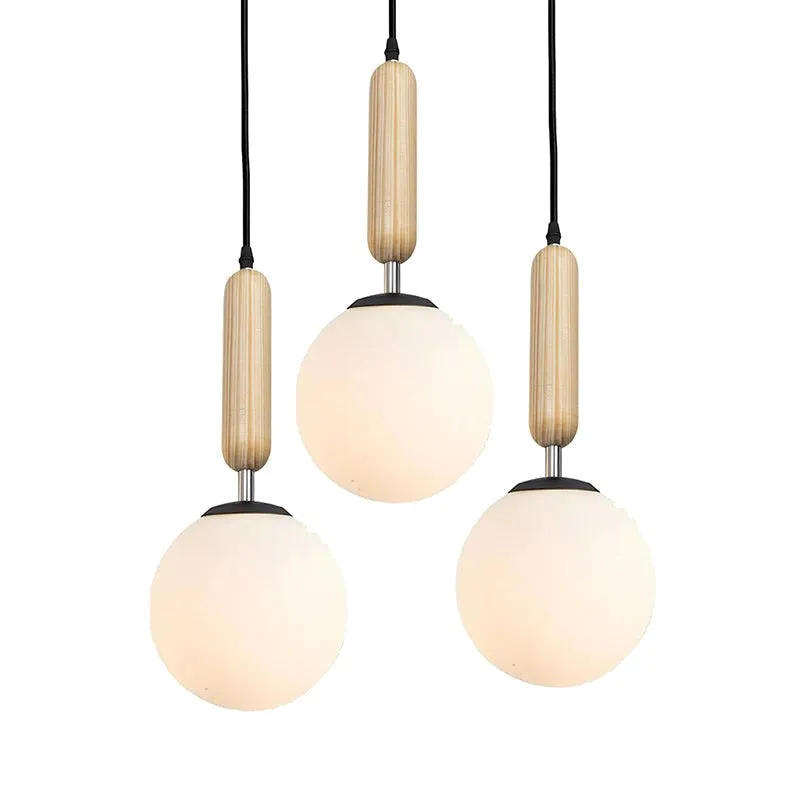 Studio view of the three-light ceiling cluster lamp with spherical glass shades