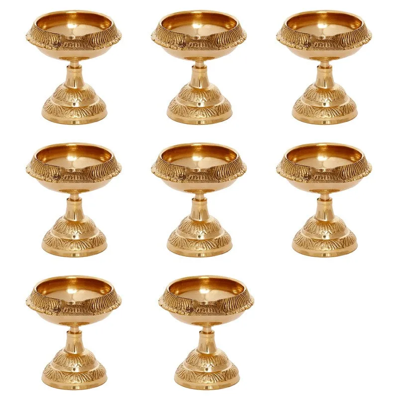 Eight matching gold brass diyas displayed individually against a white background.