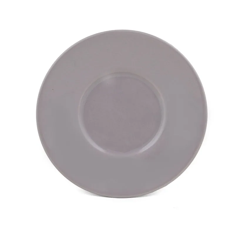 Single light purple saucer on a white background