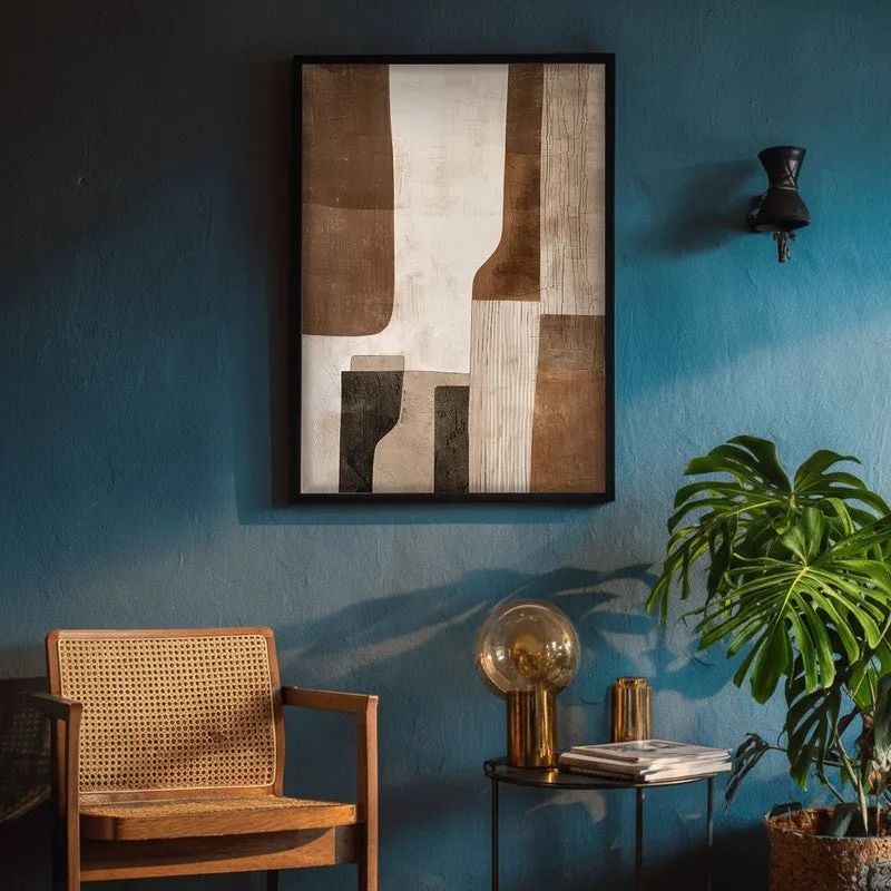 Framed abstract wall art on a deep blue wall above a chair and side table.
