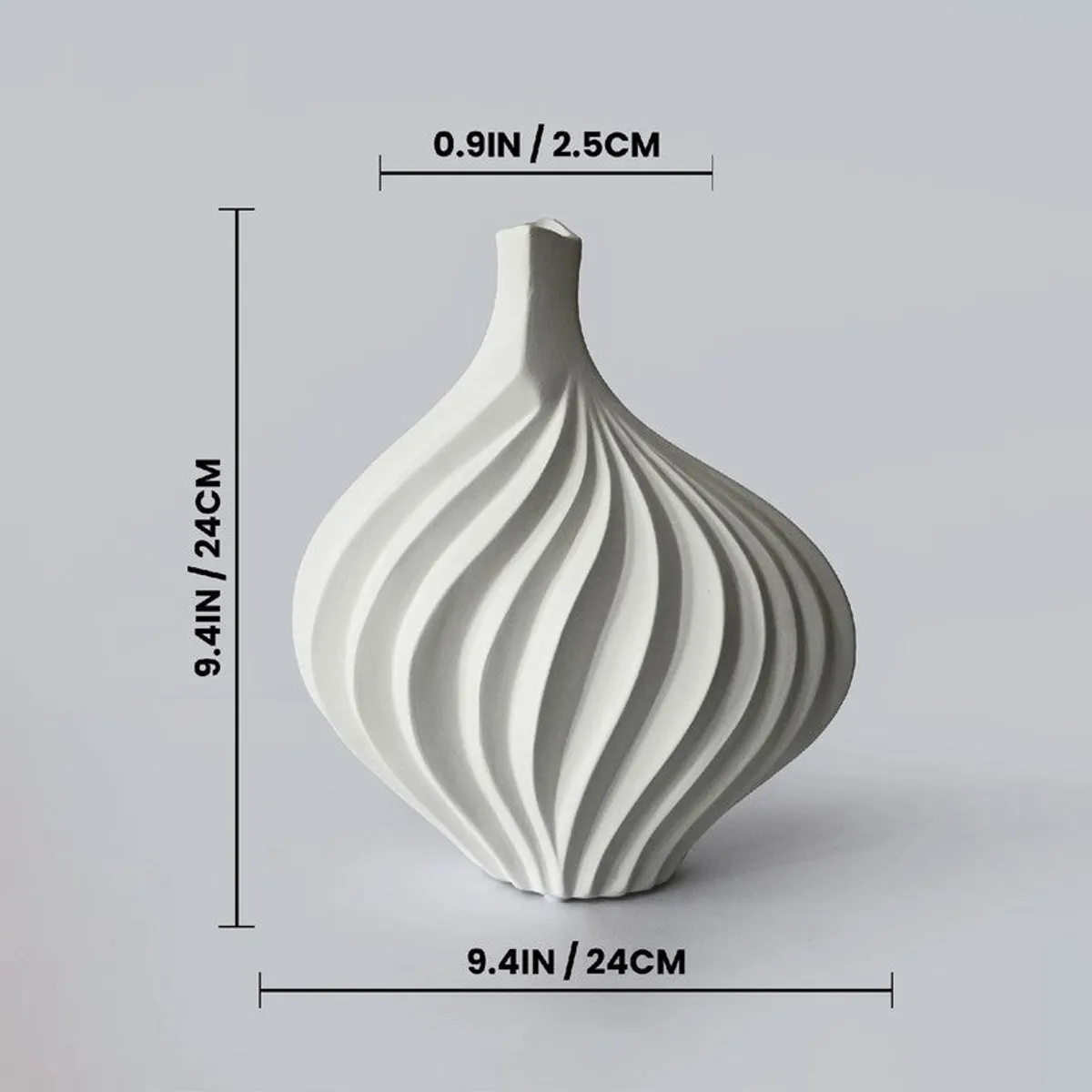 White ribbed vase on a plain background with dimension markings around it.