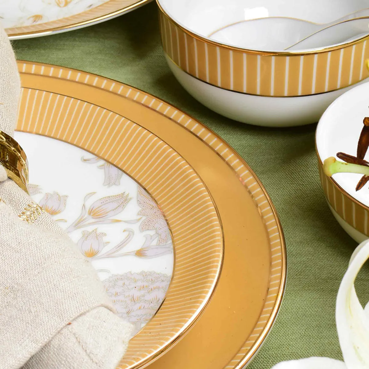 Porcelain plate with mustard border, gold stripes and floral detailing