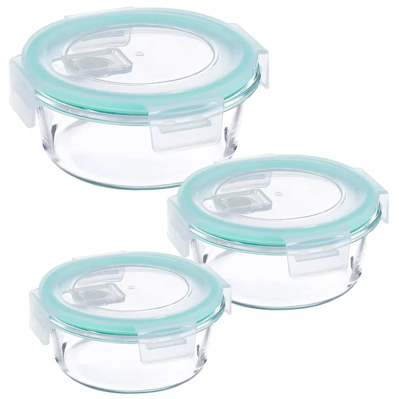 Set of three empty round glass containers with blue lids