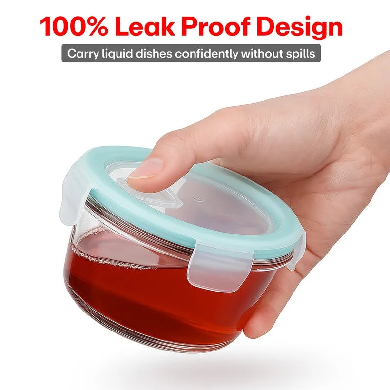 Hand holding a round glass container with red liquid inside