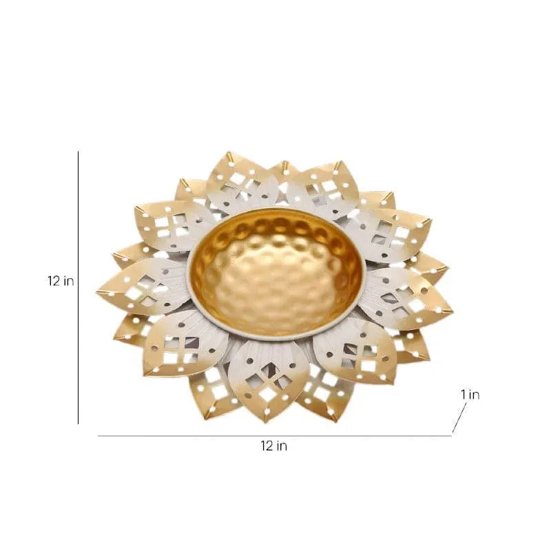 White and gold floral iron urli shown from above