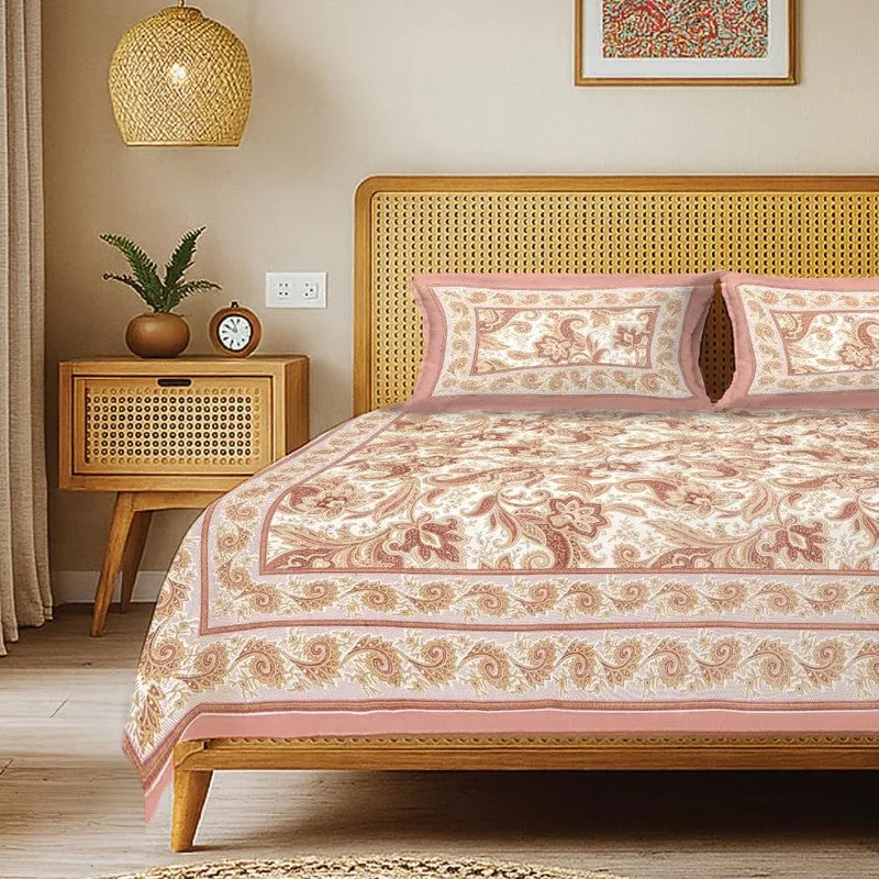 Close view of pink floral bedsheet and matching pillow covers on a bed