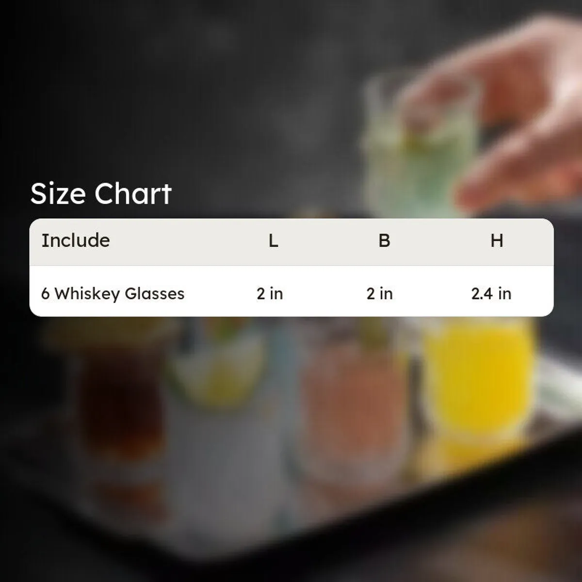 Clear whisky glasses arranged on a tray with a size chart overlay