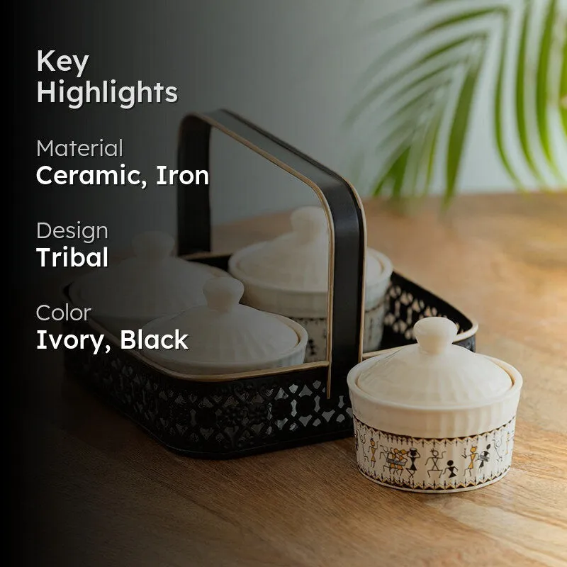 Lifestyle view of ivory ceramic jars in a black holder on a wooden table.