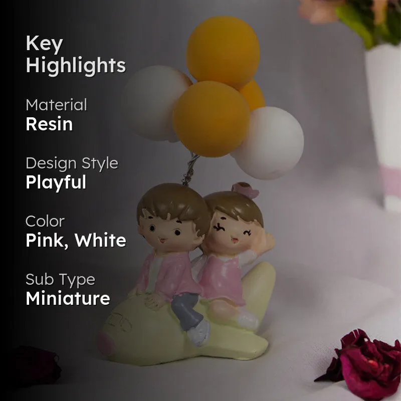 Young Love In Air Resin Showpiece - Yellow media 2