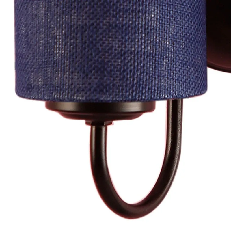 Close-up of the iron arm and navy blue jute shade