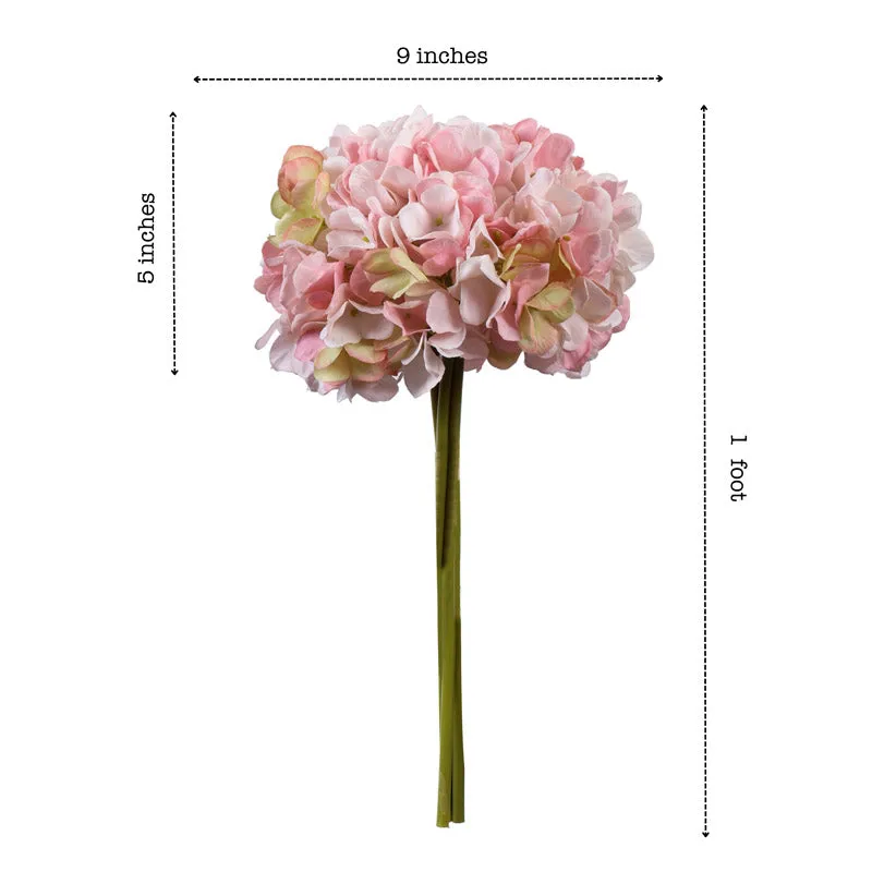 Light pink hydrangea bouquet displayed in a clear vase