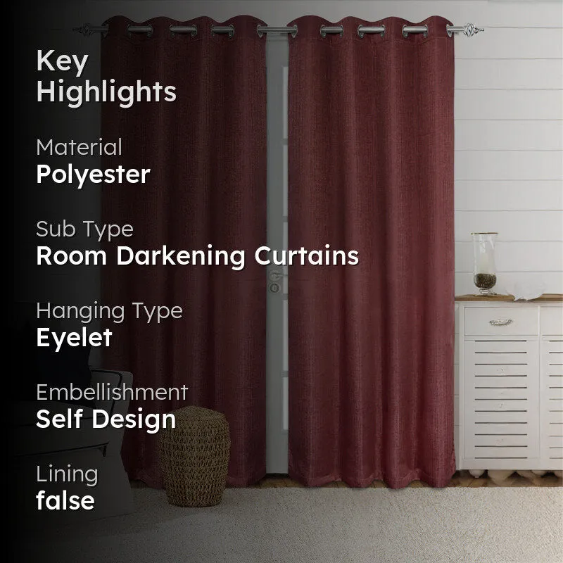 Mauve solid room-darkening curtain showing self-design woven fabric