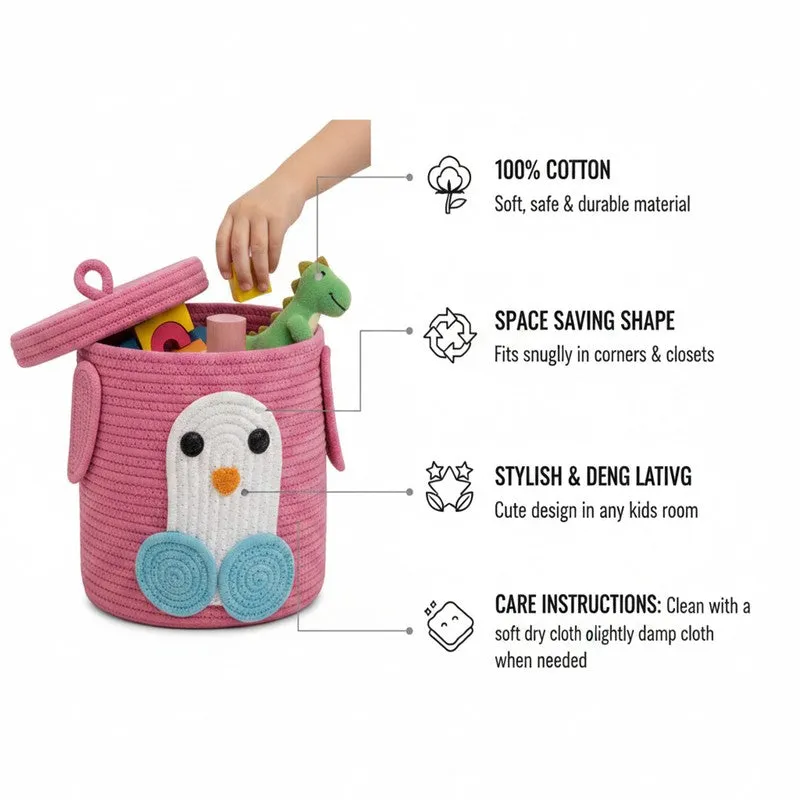 Pink penguin basket with lid shown open and a hand placing a toy inside