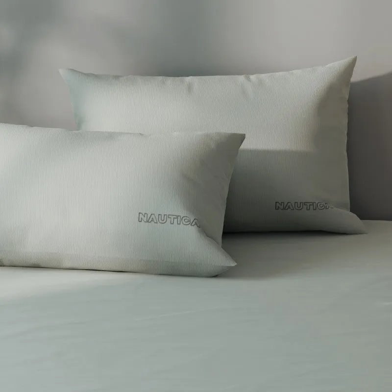 Close-up of silver grey satin cotton pillows and bedsheet