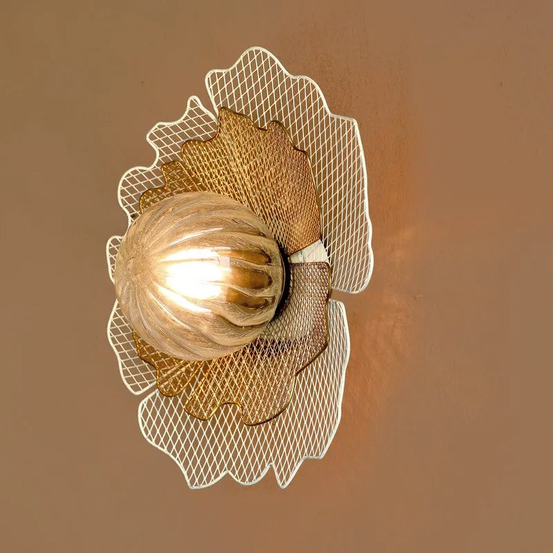Angled view of gold and white wall lamp with layered petal-like backplate