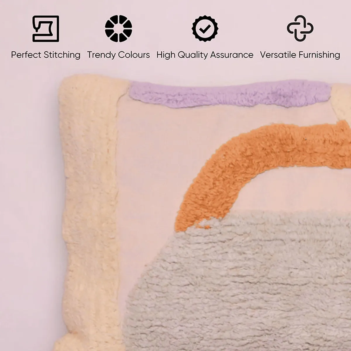 Close-up of tufted abstract cushion cover in beige, orange and lilac tones