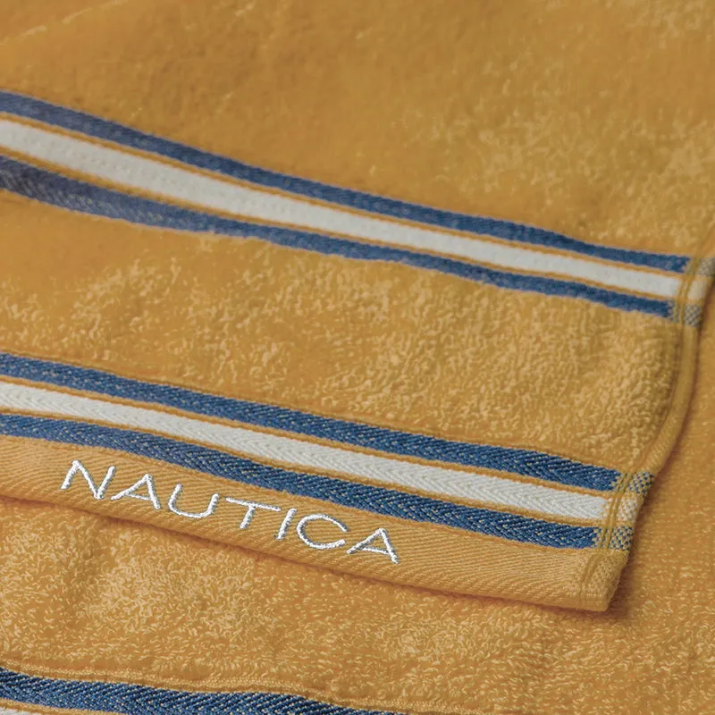 Detailed view of beige and grey towel textures with blue stripes