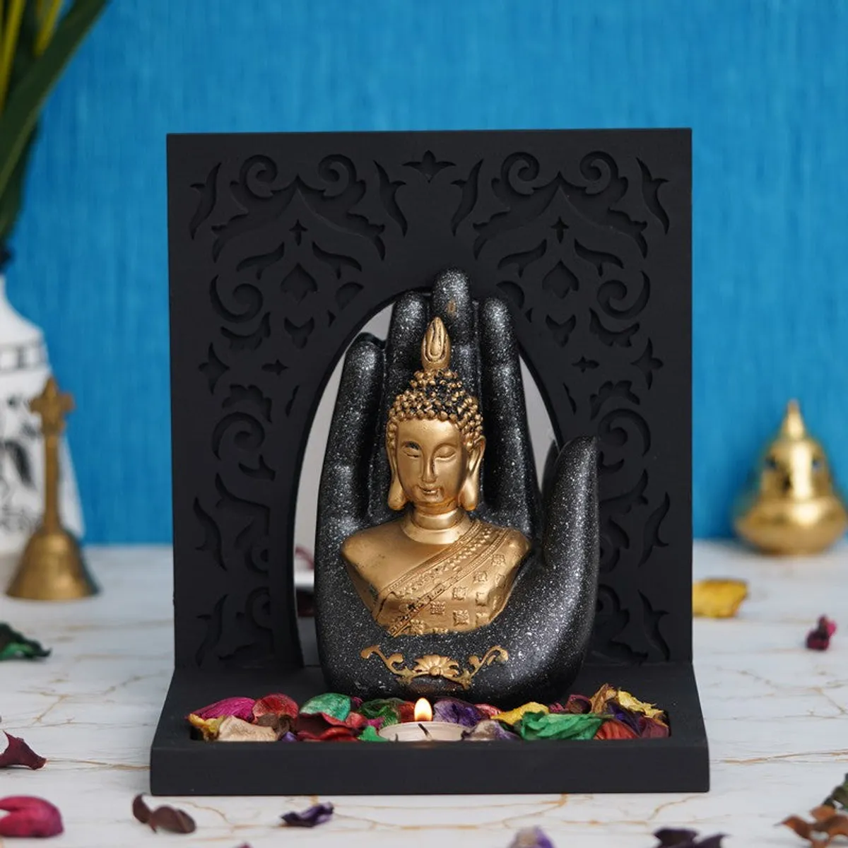 Buddha candle holder with black hand-shaped surround