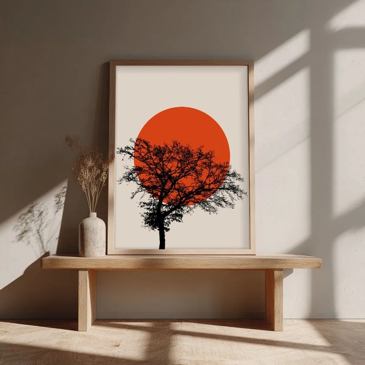Natural brown framed artwork with a black tree and orange circular sun