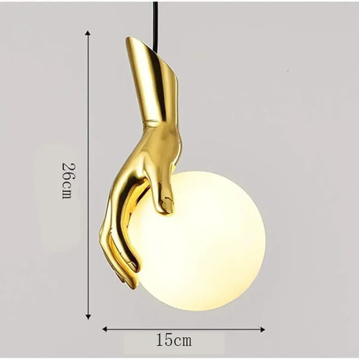 Gold hand lamp holding a white globe shown against a plain background