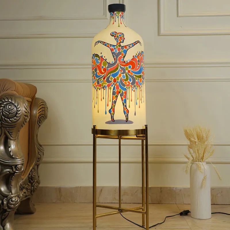 Hand-painted glass floor lamp with colourful ballerina motif on a gold-toned stand