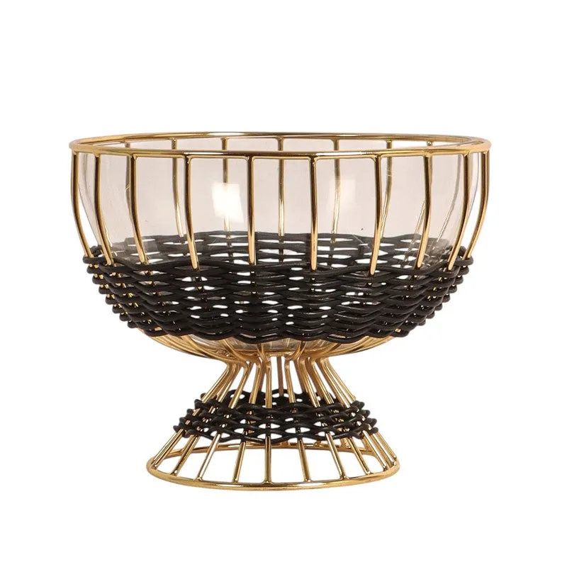 Front view of a round black and gold glass fruit bowl on a white background.