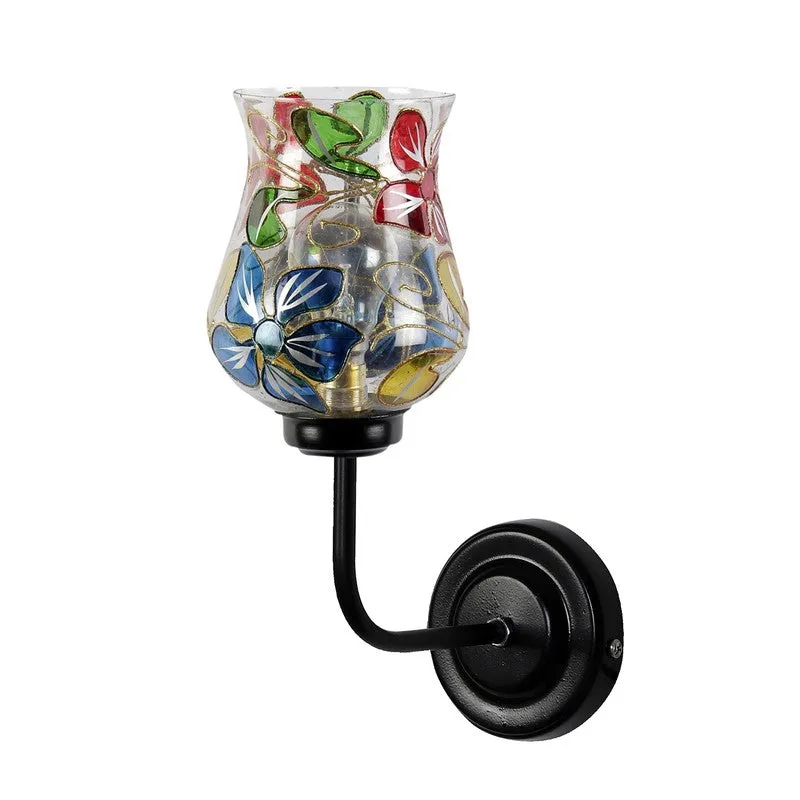 Front angled view of floral tulip glass wall lamp with black iron arm