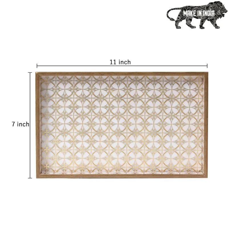 Top view of a rectangular white and gold geometric serving tray