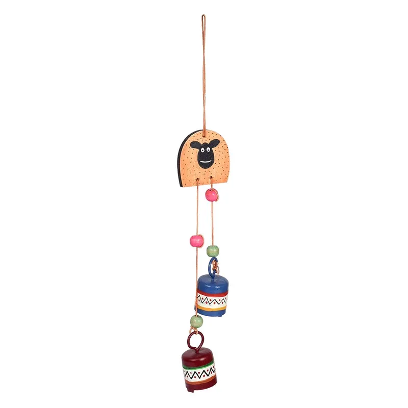 Multicolour sheep-face windchime isolated against a white background