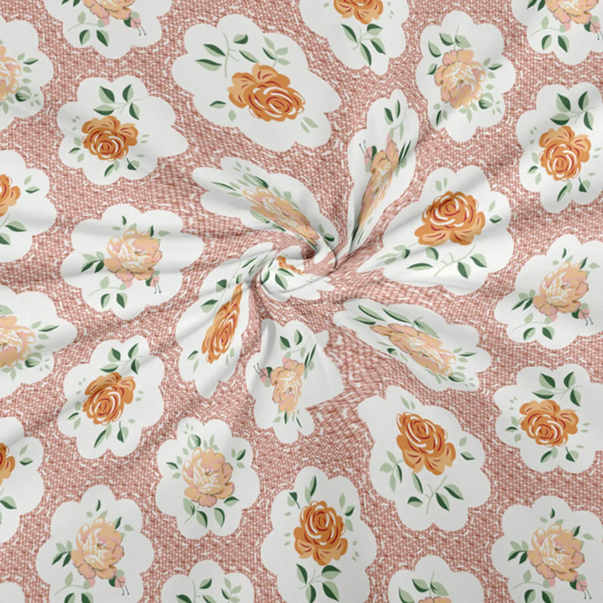 Close-up of the floral print with orange flowers, peach tones, white petals and green leaves.