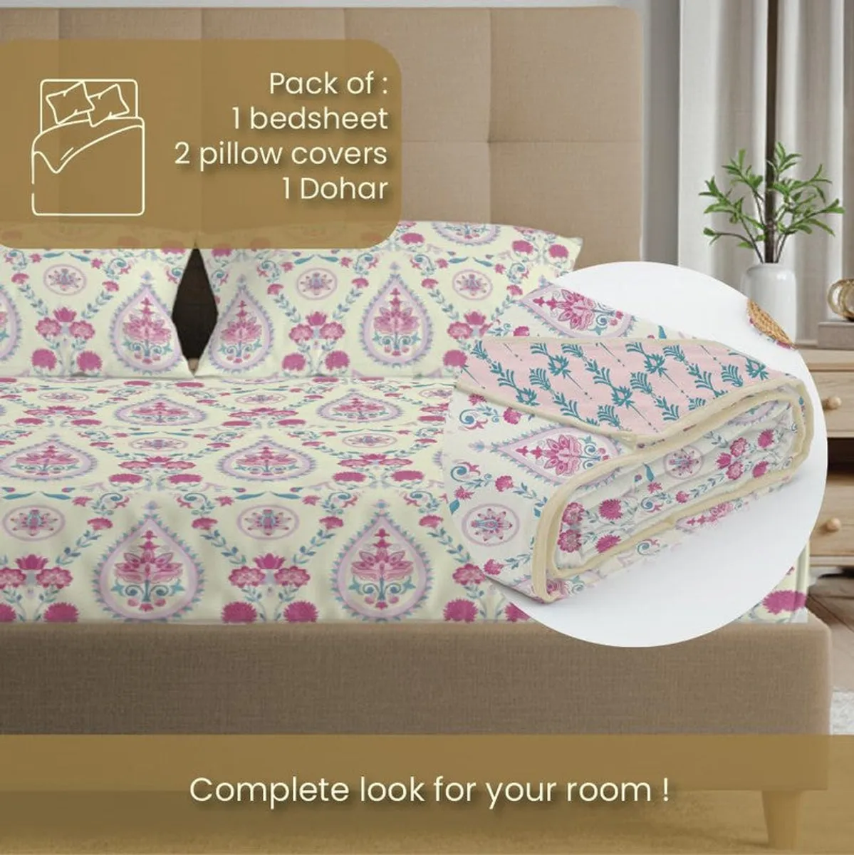 Printed bedding set with folded blanket and matching pillow covers on bed