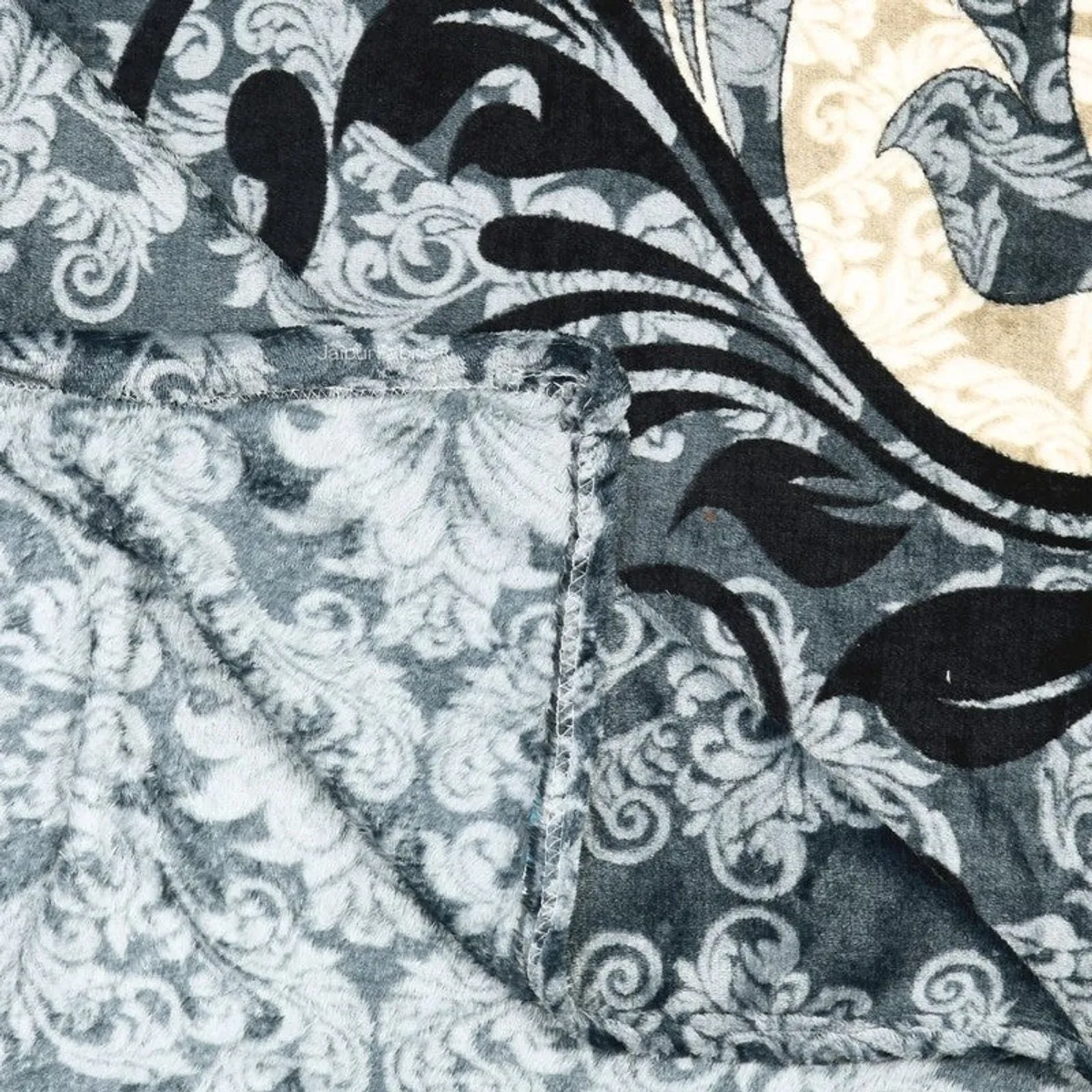 Close-up showing the soft textured surface and stitched edge of the bedsheet