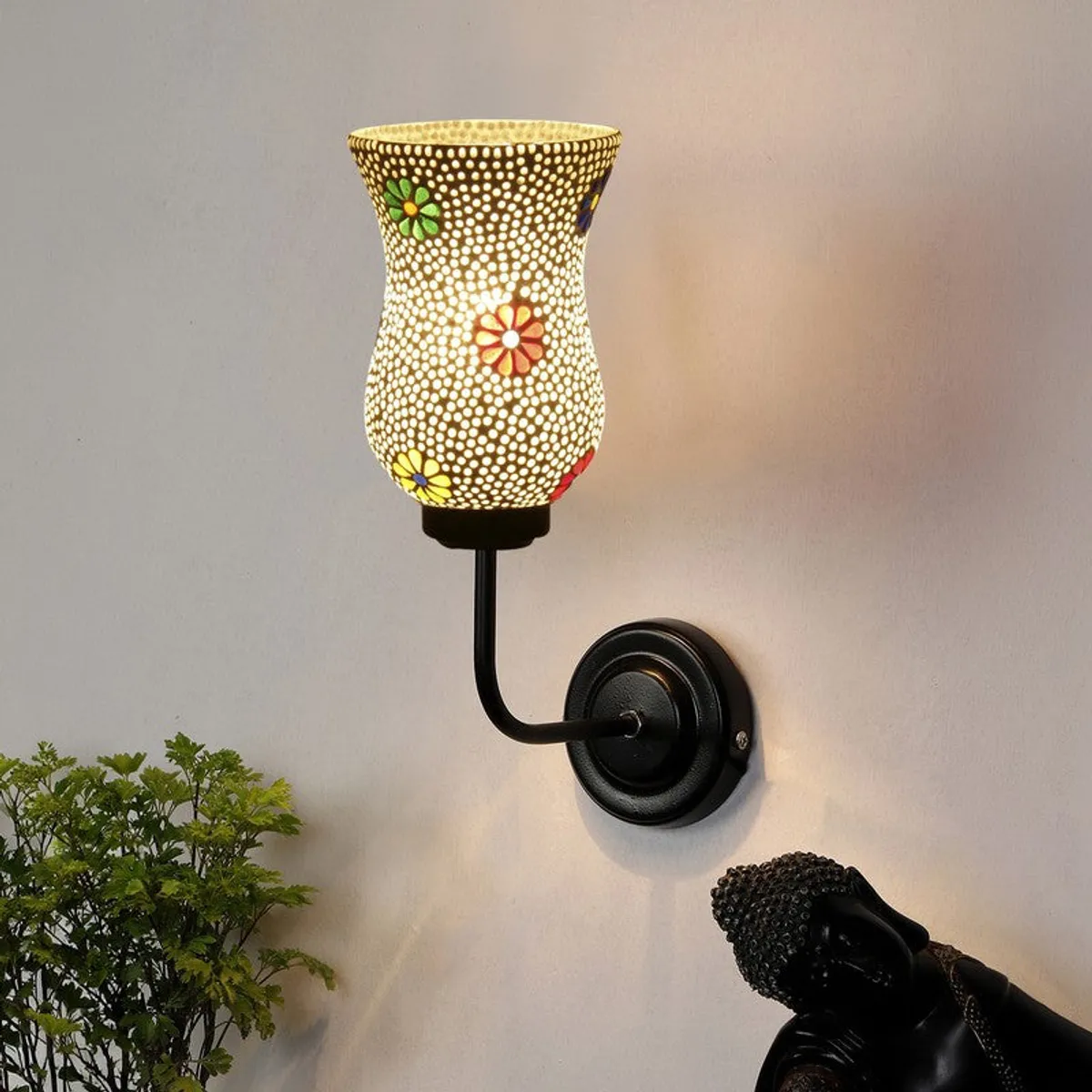 Lit mosaic glass wall lamp with black iron base and colourful flower motifs