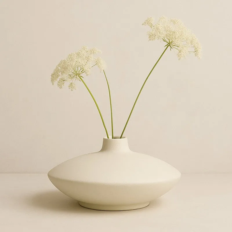 Ivory low bowl vase with delicate white floral stems