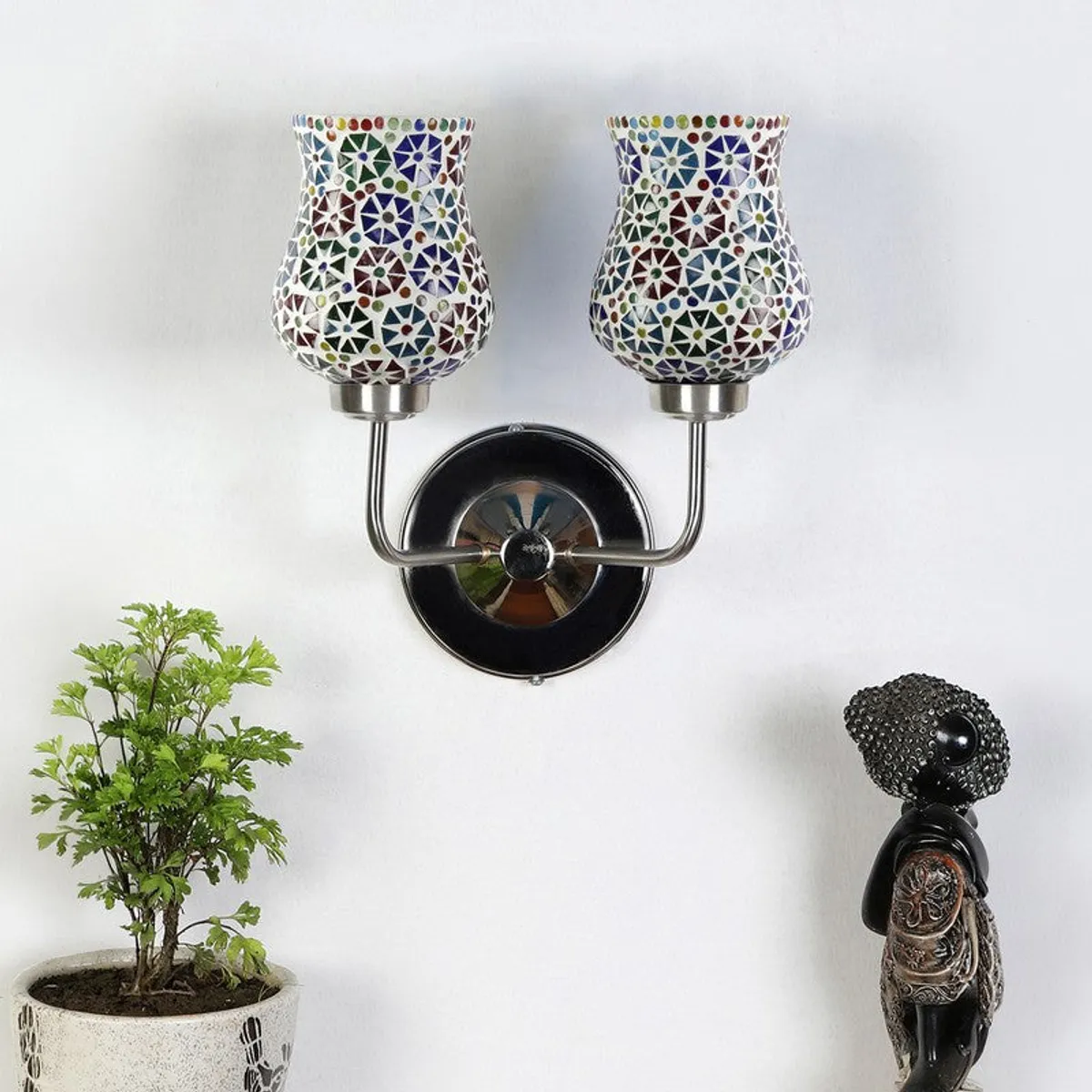 Unlit dual mosaic glass wall lamp with steel base on a white wall