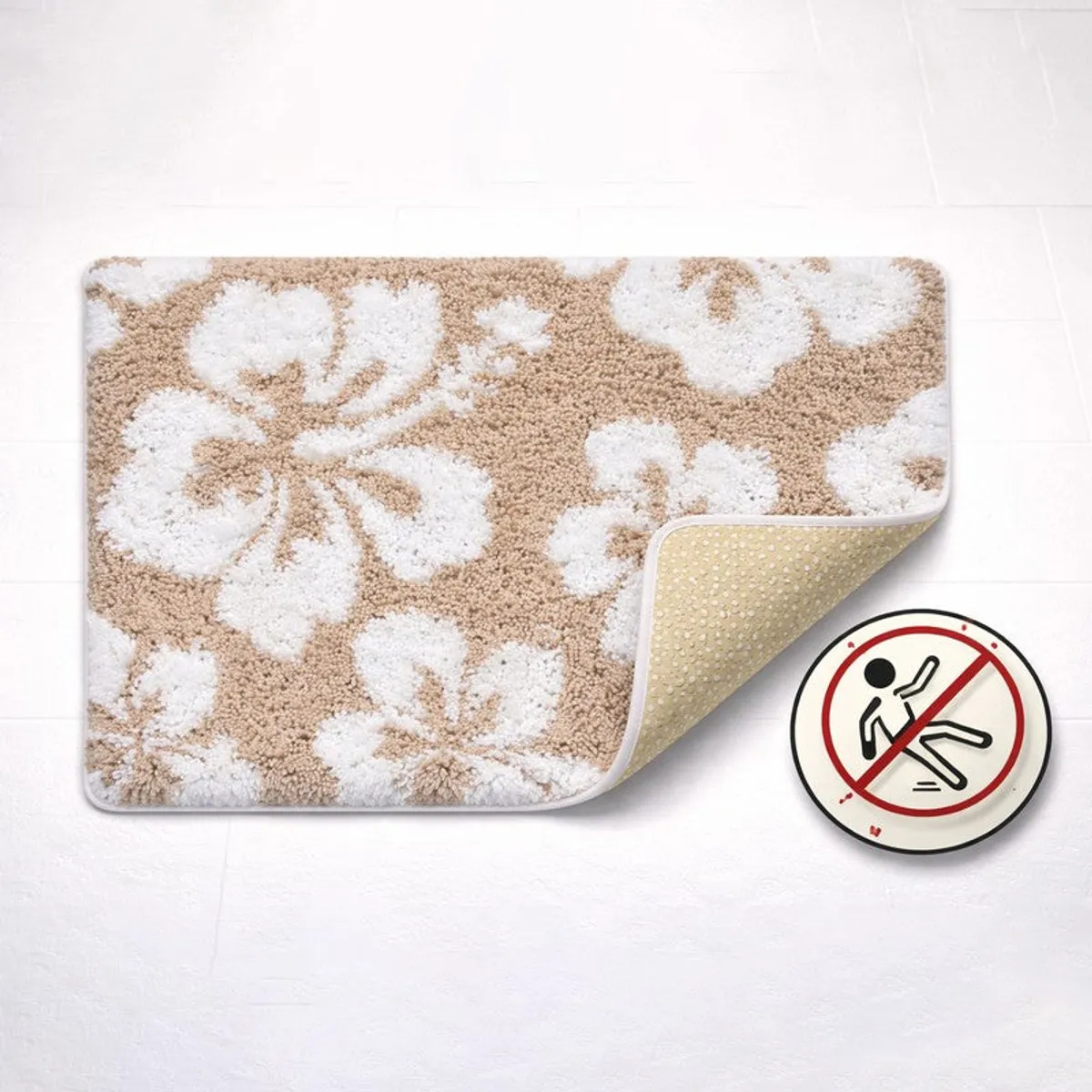 Beige and white floral bath mat with its underside corner turned up