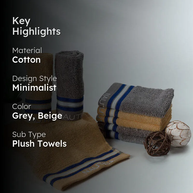 Grey and beige striped towels styled together in a bathroom setting